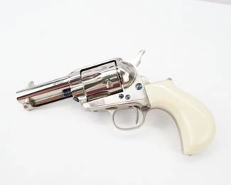 Serial # P77163 Condition: Excellent The Doc Holliday Special. 3 ½” 45LC Nickel-plated and Tru Ivory grips. Each gun has “Doc Holliday” hand engraved into the backstrap, along with the number of the gun. Also comes with a Tru Ivory™ gripped dagger engraved with the same number just in case you run out of ammunition. This revolver is in excellent condition showing normal signs of use and wear.
