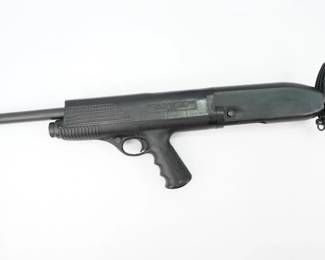 Serial # 11024 Condition: Excellent The High Standard Model Ten (HS10) is a gas operated, semi-automatic shotgun that was manufactured by the High Standard Manufacturing Company of Hamden, Connecticut. It is easily recognized by its bullpup design and rotatable shoulder/hip stock.Originally, the Model 10 was sold to law enforcement only. The concept of this shotgun was quite interesting to many police agencies who adopted the Model 10 in the late 1960s and early 1970s. Shortly later ending production. This Shotgun is a Single Side charged and is in Excellent condition showing normal signs of use and wear. 