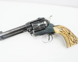 This Ruger Single six chambered in 22 Cal features a 4.75 inch barrel and it was manufactured between 1960-1961. The Ruger Single-Six is a single-action rimfire revolver produced by Sturm, Ruger & Co. The Single-Six was first released in June 1953. The Single-Six is currently produced as the New Model Single-Six. This Revolver is in Good condition showing signs of use and holster wear. 
