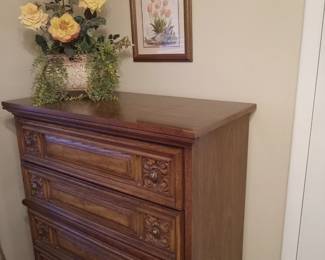 Upright chest matching the full bed. Florals & art.