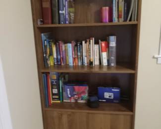 Bookcase with storage, books, cameras