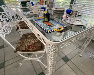 Glass top wrought iron table & 6 chairs