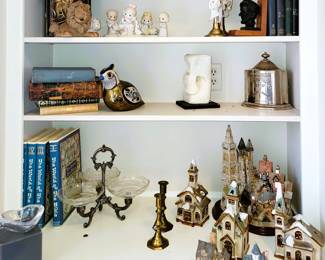 Decorative houses, old books, boxes, figurines and decor
