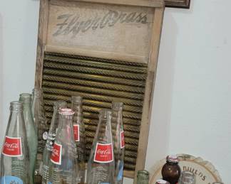 Old Coke and beer bottles. Old wash board