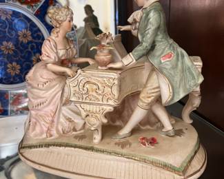 Couple with piano figurine