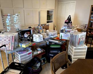 A crafters dream .... too many items to name but a HUGE collection of stamping and scrapbooking items. Paper, ink, scissors, paper kits, shelving, storage .. and more