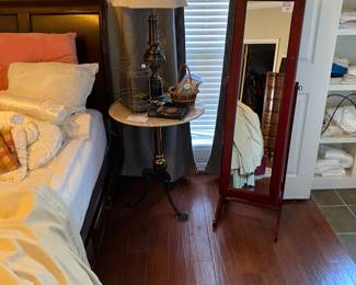 Marble top side table with cast iron legs…very heavy!!! Mirrored jewelry armoire…