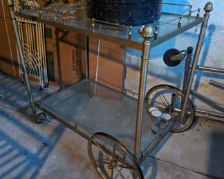 Vintage gold or brass bar cart with glass shelves
