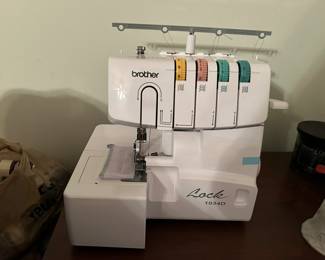 Brother serge overlock machine new with box. 26 spools of different threads.