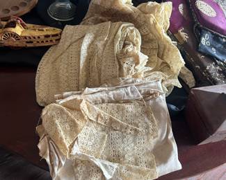 fenton art glass, stack of lace and linens