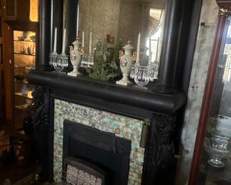 crystal and glassware on Victorian mantle in bedroom
