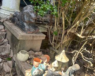 garden items sitting on steps at front entrance to house