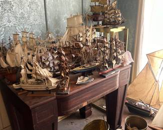 dozens ships sitting on antique table