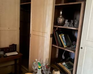 closets and cabinets full of books and glassware