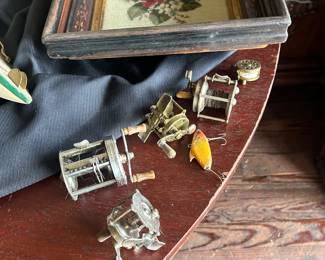 vintage artwork and antique fishing reels
