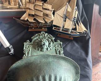 artwork of New Orleans, cast iron wall fountain and vintage ships, just a sample of the dozens in the house