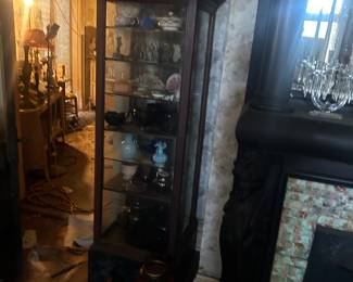 curio cabinet full of collectibles