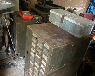 old tools and metal storage boxes in outside storage buildings