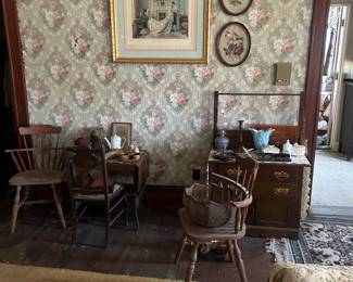 antiques and artwork in bedroom