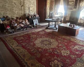 large rug and collectibles in bedroom