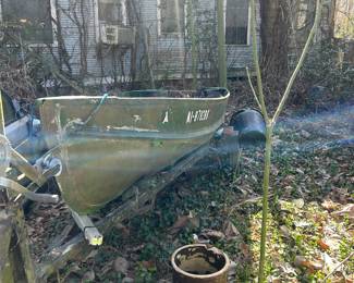 side view of house boats and trailer