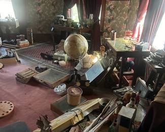 antique globe on stand and signage in library