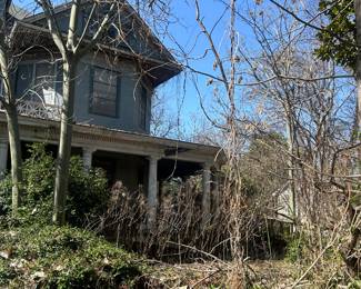 view on east round porch and second floor or house