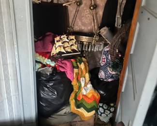 closet full of vintage clothing and items