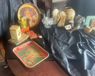 grouping of antique store items, glassware and marble, on round antique empire style table