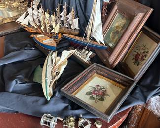 grouping of art, ships and fishing items
