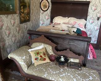 recamier, antique bed, artwork, pillows and linens in upstairs bedroom