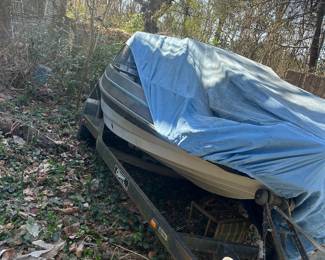 90's model ski boat and trailer