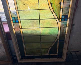 antique stained glass window in frame