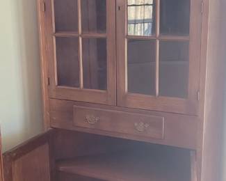 Furniture item #2:  Twelve pane glass front corner cabinet.  30" deep x 40" w x 74" tall