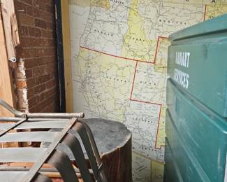 Outdoor Steel Chair alognside massive tree stump tables