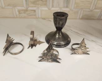 STERLING SILVER CANDLE HOLSER AND 4 NAPKIN RINGS