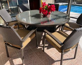 $500 - 60" round resin wicker table with 6 chairs