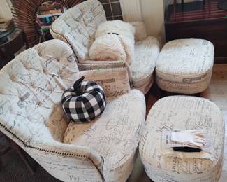 Pair of stuffed arm chairs and ottomans 