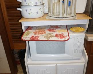 bowls, appliance cabinet, microwave,