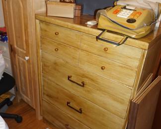 chest of drawers, vintage adding machine, Norman Rockwell posters,