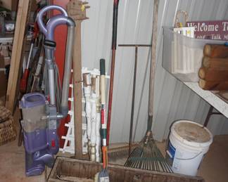brooms, vacuum, wood box, rake,
