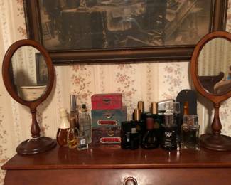 Perfumes, colognes.  Two old wood shaving mirrors.  