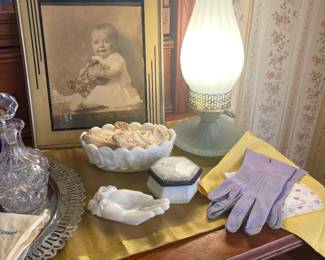 Antique baby in Art Deco frame, Antique fabric baby booties with French knots detail, milk glass, gloves, hair kerchief 