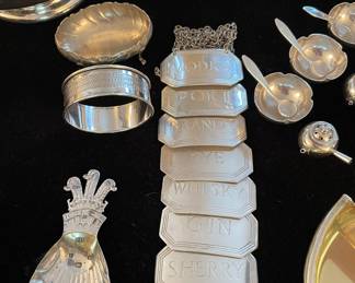 Set of 8 Asprey Sterling Liquor Tags, Sterling Napkin Rings, and Sterling Tea Caddy Spoon