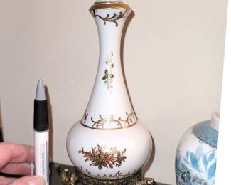 Vintage porcelain decanter on cherub stand