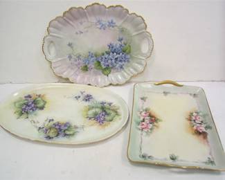 THREE HAND PAINTED PORCELAIN DRESSER TRAYS