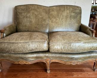 Louis XV-Style Full-Grain Moss Colored Leather Loveseat. Solid Maple Frame with Burnished Cherry Finish. Down-Filled Cushions. Measures 54" W x 33.5" H x 33.5" D. Photo 1 of 4.