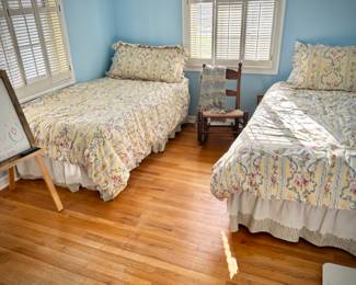 Twin beds and vintage rocking chair 