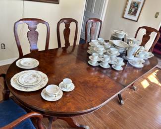 Large antique Duncan Phyfe-style dining table with two leaves (only one is shown) and eight chairs. Chair bottoms easily removed to recover.