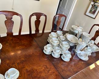 Large antique Duncan Phyfe-style dining table with two leaves (only one is shown) and eight chairs. Chair bottoms easily removed to recover.